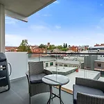 Sleek City Pad With A Garden Rooftop